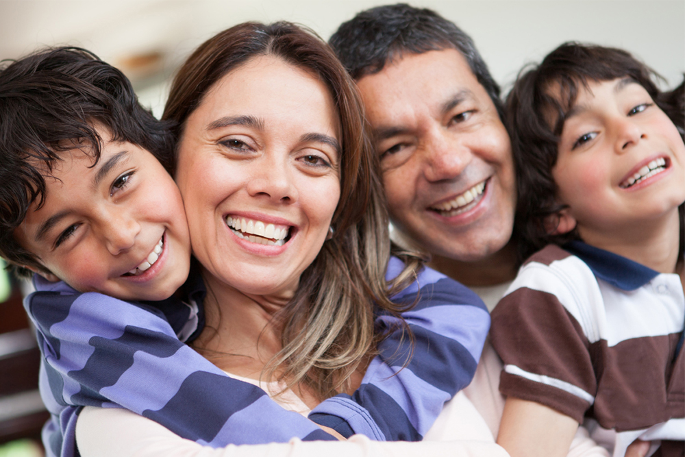 Family dentist in Windsor teaching children proper brushing techniques at Foresto Dentistry